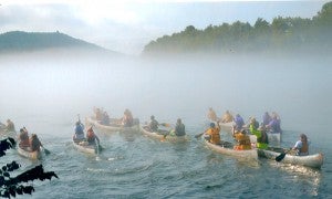 COURTESY PHOTO Amid a heavy fog, canoers begin a leg of the 3-day, 8-leg National Invitational White River Canoe Race.