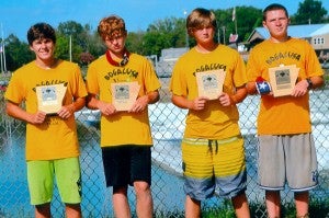 The Boys Novice Aluminum National Champions are pictured with their individual plaques they won at the White River Canoe Race. They are, from left, James Stevenson III, Rage Rivers, Timothy Rester and Lloyd Sanchez.
