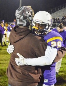 Senior Tremario Magee gets a hug after the game. 