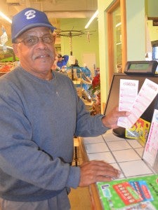 Floyd Timmons checks out the Powerball tickets in anticipation of Wednesday’s drawing. The drawing is up to an estimated $1.5 billion.